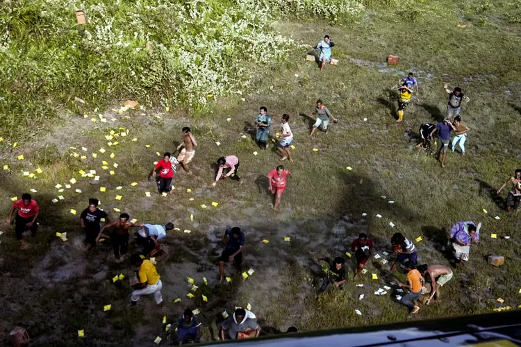 A viral video depicting North Sumatra Governor Muhammad Bobby Afif Nasution, accompanied by military personnel (TNI, or Indonesian National Armed Forces), airdropping food packages