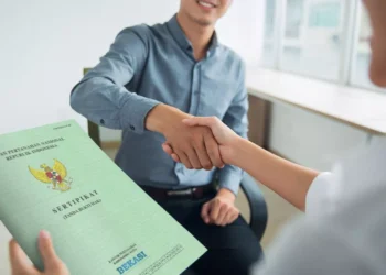 Photo of handover of land certificate