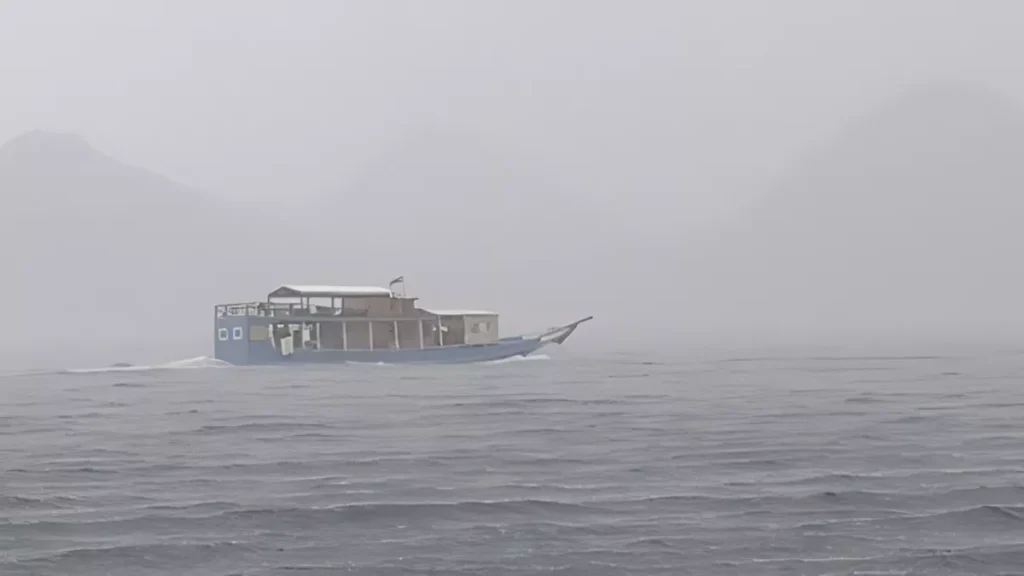 A phinisi ship sails amidst heavy rain in the waters off Labuan Bajo some time ago.