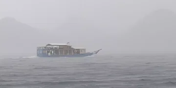 A phinisi ship sails amidst heavy rain in the waters off Labuan Bajo some time ago.
