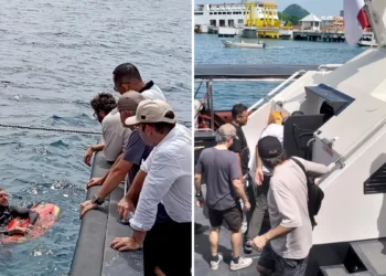 The victim's family talks with a diver involved in the search for victims in the Padar Island Strait, Thursday (January 1, 2026).