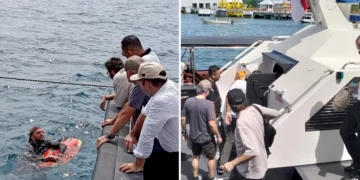 The victim's family talks with a diver involved in the search for victims in the Padar Island Strait, Thursday (January 1, 2026).
