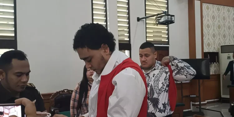 Two defendants in the shooting of an Australian citizen after their trial at the Denpasar District Court on Monday (January 12, 2026).