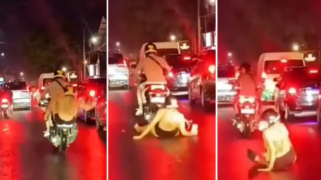 Video Screenshot of a Caucasian woman falling off her motorbike because she was busy playing with her cellphone in Canggu, Bali