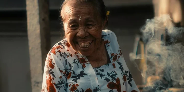 The Finnish Formula for Happiness: A Mirror for Bali's Soul in the Age of Instagram 37 Illustration photo of a grandmother in Bali looking happy smiling (hey bali )