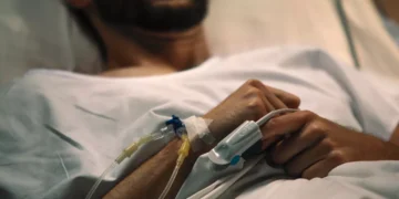 Illustration photo of a man lying weak in hospital