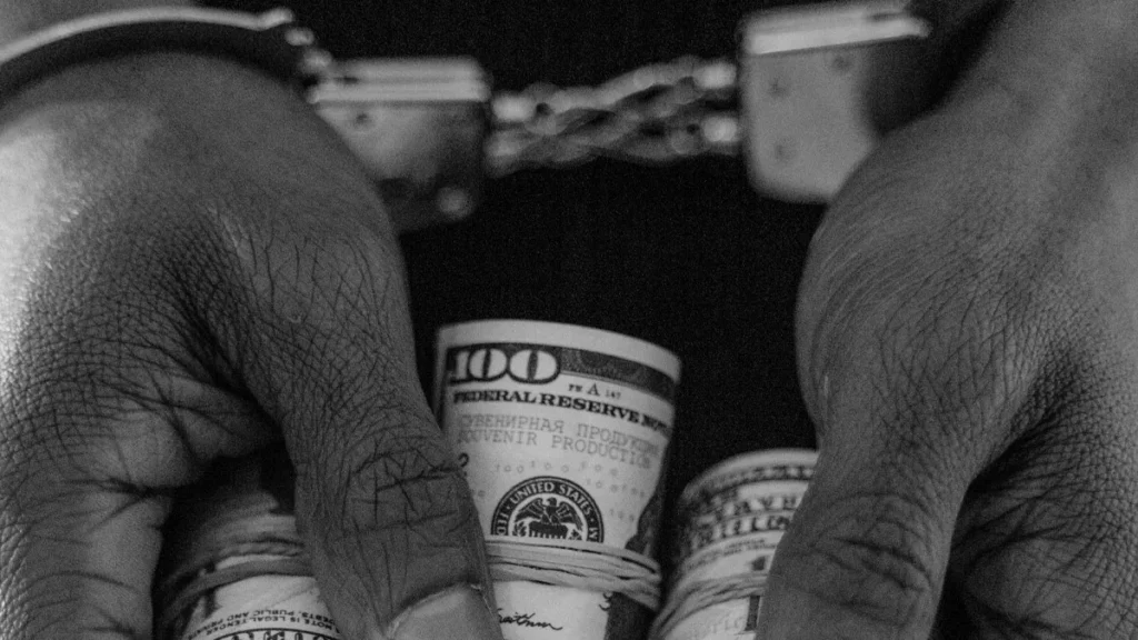 A Troubling Pattern Emerges: Foreign Nationals Linked to Violent Crime and Cyber Offenses in Bali’s First Quarter of 2026 39
Illustration of a criminal being handcuffed and holding US dollars. This is to illustrate the level of crime involving foreign nationals in Bali and related to money (Pexels)