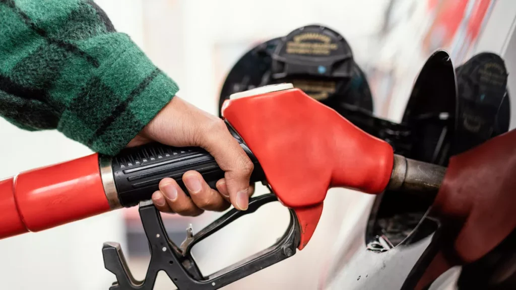 Illustration photo of someone filling up with petrol at a gas station