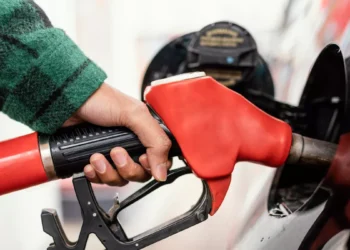 Illustration photo of someone filling up with petrol at a gas station