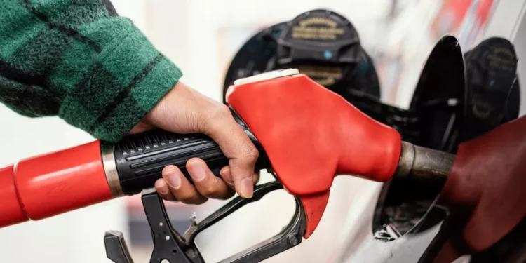 Illustration photo of someone filling up with petrol at a gas station