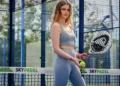 When Passion Becomes Pain: The Risks of Overtraining in Bali’s Booming Sports Scene 47 Illustration photo of a Caucasian woman posing on a Padel court while holding a padel ball and racket (Pexels)