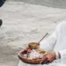 Understanding Bali’s Sacred Days: What March 21, 2026 Means for Travelers and Residents 44 Photo of a Hindu priest in Bali praying in front of a temple (Pexels)