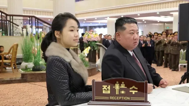 In North Korea, a Hairstyle May Carry a Price: Reports of a Ban Linked to Kim Jong-un’s Daughter Raise Questions 39 Photo: North Korean leader Kim Jong Un and his daughter Kim Ju Ae stand at a hotel reception desk while attending the inauguration ceremony of hotels in the Samjiyon City tourist area, North Korea, December 20, 2025, in this photo released by North Korea's official Korean Central News Agency (KCNA). (via REUTERS/KCNA)