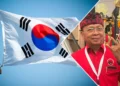 Photo Collage of the South Korean Flag and Bali Governor I Wayan Koster (Ist)