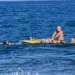 Photo: Murtiningsih receiving first aid from Gianyar Balawista (lifeguard) personnel and several foreign tourists at the water's edge, Wednesday (June 24, 2026). (Courtesy of BPBD Gianyar)