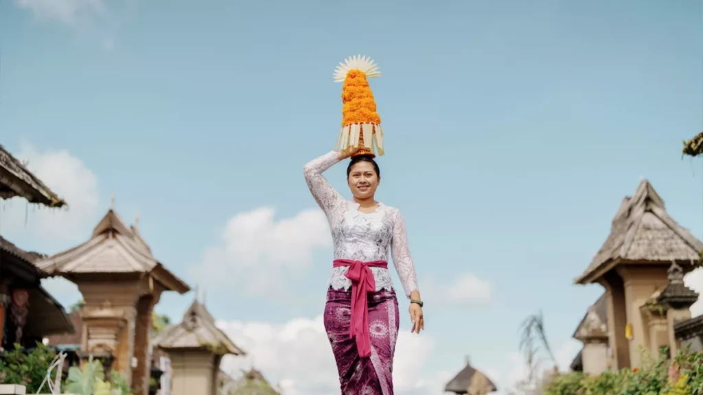 Most Visitors Think Galungan Is One Holiday. Bali's Ancient Texts Say There Are Three. 38 A river of devotion flows through a Balinese village as women carry elaborate gebogan offerings during Galungan, one of Bali's most sacred celebrations honoring the triumph of good over evil.