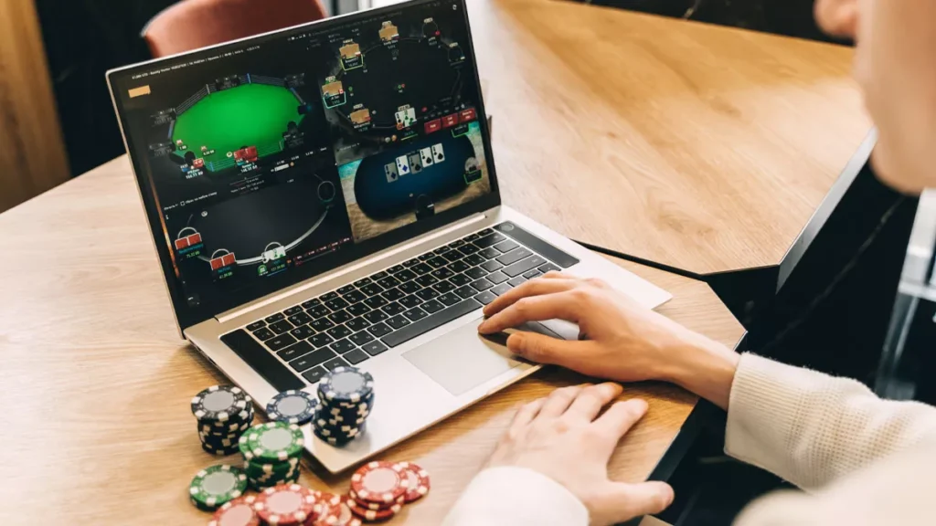 Illustration of someone playing online gambling on a laptop.