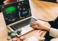Illustration of someone playing online gambling on a laptop.