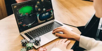 Illustration of someone playing online gambling on a laptop.