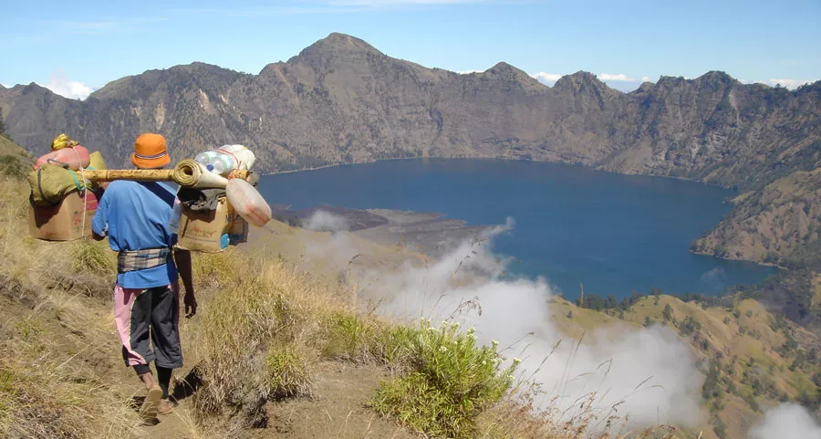 Mount Rinjani Is Raising the Bar: All Guides and Porters to Carry Official Access Cards Under New Safety Push 38 Photo of Porters helping to carry goods on Mount Rinjani
