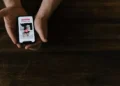 Illustration photo of someone using the Tinder application