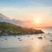 Sunset Point Amed, Bali: 5 Reasons This East Bali Clifftop Deserves a Spot on Your Itinerary 46 A view of the north coast of Bali at sunset—featuring the peak of Mount Agung, forested slopes, and the Java Sea—seen from a hilltop near Amed, Bali, Indonesia. (depositphotos.com/emcamposphoto)