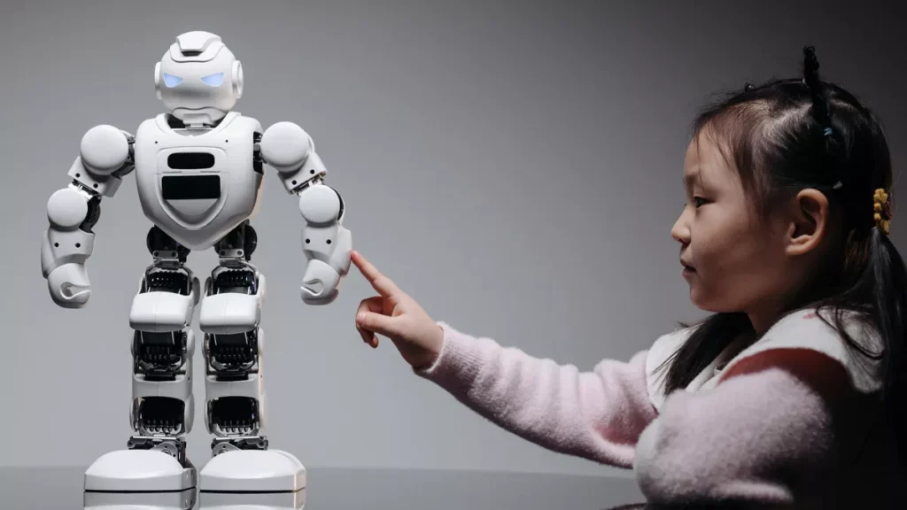 An illustrative photo of a young girl interested in learning about technology and AI through robotics.