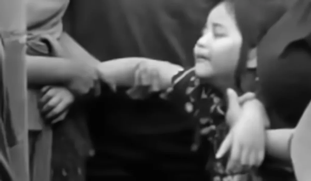 "He Left Behind a Wife and Three Children": The Village Chief Who Fetched a Mob Victim's Body Speaks Out 1 Photo: A first-grade student—the child of an alleged chicken thief who was killed by a mob—weeps over his father's body at the funeral home. (Instagram screenshot)