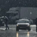 Heavy rain falls over a roadway during severe weather as BMKG issues a heavy rain and strong wind warning across East Nusa Tenggara (NTT), Indonesia.