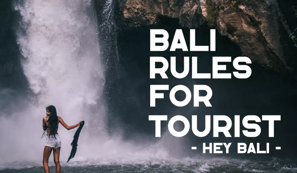 Bali rules for tourists guide featuring a visitor enjoying a waterfall while practicing responsible travel and respecting local customs.