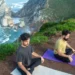 People practicing mindfulness meditation outdoors to calm a racing mind naturally