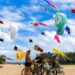 Visitors watch giant international kites during the Rare Angon Festival at Mertasari Beach in Sanur, Bali.