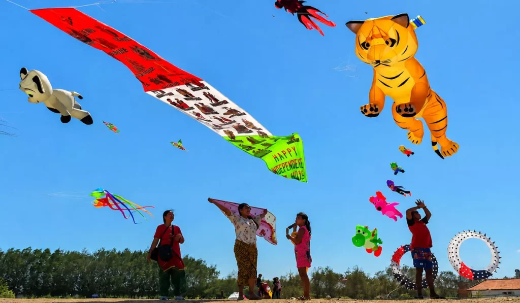 Thousands of Kites, Some Over 25 Meters Long, Take Over Sanur's Skies for Bali's Rare Angon Festival 38 Giant colorful kites fill the sky during the Rare Angon Kite Festival at Mertasari Beach, Sanur, Bali.