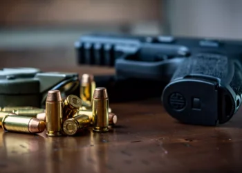 Bali Police Investigate Gun's Origin After Canadian Man Found Dead With Four Live Rounds Still in Magazine 39 Illustration of a handgun and bullets
