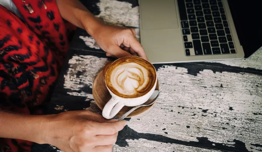 What Your Coffee Order at a Canggu Cafe Might Say About You, According to Psychology 40 Remote worker enjoying a latte at a Canggu café as coffee psychology explores how coffee personality may influence drink choices in Bali.