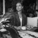 Digital nomad working from a Bali café with coffee, reflecting the connection between coffee culture, productivity, and personality.