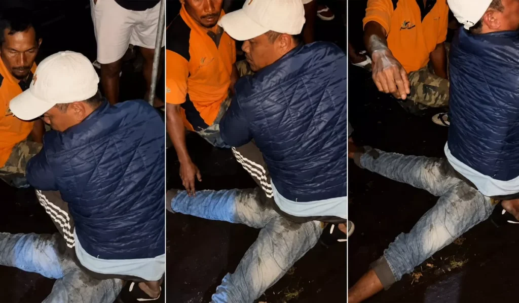 A screenshot from a viral social media video showing a man being subjected to mob justice in Tabanan, Bali.