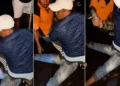 A screenshot from a viral social media video showing a man being subjected to mob justice in Tabanan, Bali.