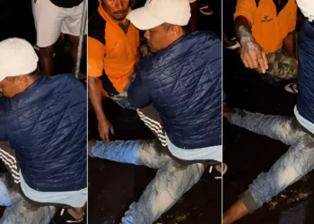 A screenshot from a viral social media video showing a man being subjected to mob justice in Tabanan, Bali.