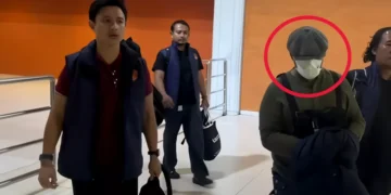 Manhunt Ends: Canggu Bar Shooting Suspect Arrested at Jakarta Airport Less Than 24 Hours After Attack 2 Police escorted the perpetrator of the Canggu shooting from the I Gusti Ngurah Rai Airport Domestic Terminal in Badung, Bali, to the Badung District Police headquarters early Sunday morning. (Photo: Badung District Police)