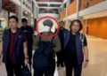Police escorted the perpetrator of the Canggu shooting from the Domestic Terminal of I Gusti Ngurah Rai Airport, Badung, Bali, to the Badung District Police headquarters early Sunday morning. Photo: Badung District Police.