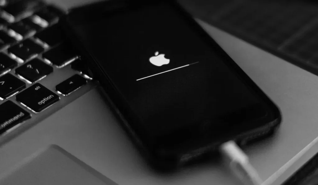 Why Does Your Phone Overheat When Charging, and Why Does It Get Even Worse in Bali? 39 Smartphone connected to a charger during charging, highlighting battery heat and charging safety.