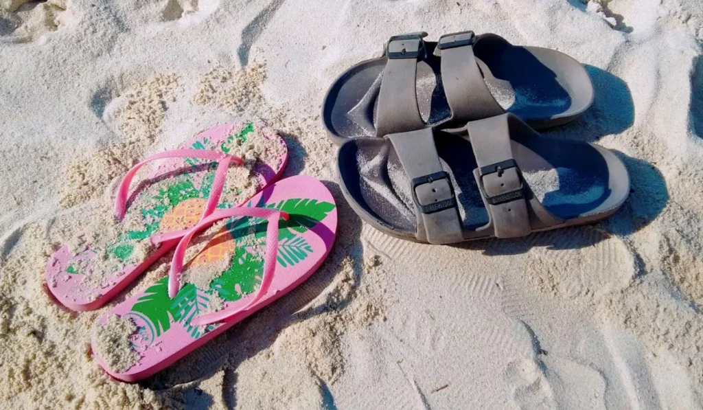 What Shoes Should You Wear in Bali? Sandals, Sneakers or Hiking Boots? 44 Flip-flops and walking sandals for Bali on a sandy beach, comparing the best sandals for tropical island travel.