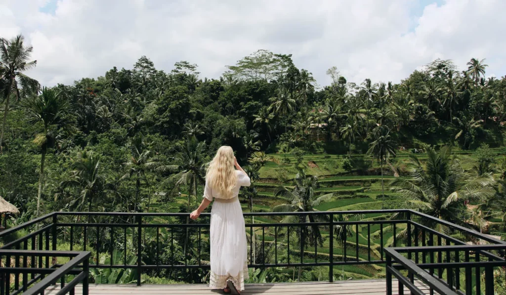Slow Tourism in Bali: Why More Travelers Are Skipping the Checklist and Staying Put 40 Slow Tourism in Bali overlooking Ubud's rice terraces while exploring one destination more deeply instead of visiting multiple locations in a day.