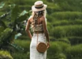Slow Tourism in Bali walking through lush rice fields and supporting local communities by exploring at a slower pace.