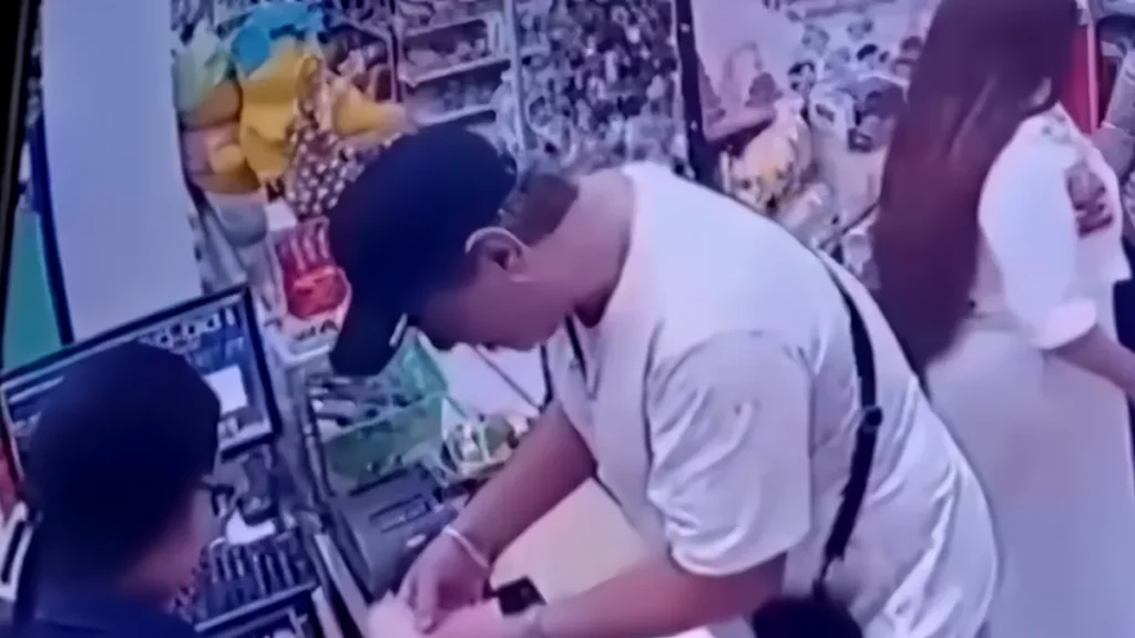 Iranian National Arrested for Stealing Cash From Minimarket in Munggu Using Fake Currency-Swap Scam 1 CCTV footage showing an Iranian man allegedly stealing money via a currency exchange ruse at a convenience store in the Munggu area, Badung, Bali. (Photo: Courtesy)