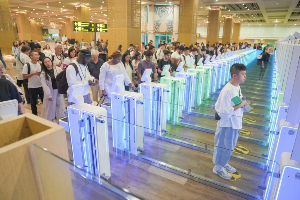 International travellers use automated immigration gates at an Indonesian airport as the country strengthens its selective immigration policy.