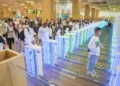 International travellers use automated immigration gates at an Indonesian airport as the country strengthens its selective immigration policy.