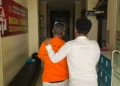 A photo of the Canggu shooting suspect, who is now officially in custody at the Badung District Police.