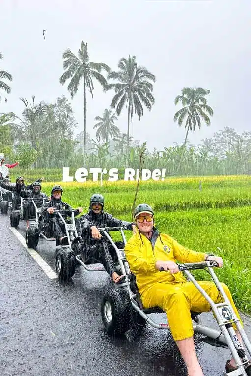 Family splashing through puddles on Bali downhill cart - safe wet-weather fun with helmets